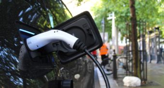 A photo of a charger in a black electric vehicle. (Photo: Andrew Roberts / Unsplash)