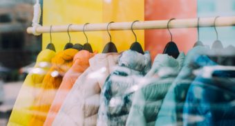 A photo of jackets hung on a clothing rack. (Photo: The Nix Company / Unsplash)