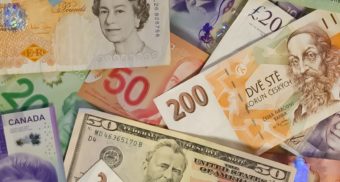 A photo of currency from various countries. (Photo: John McArthur / Unsplash)