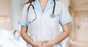 A health care employee, like those employed by SE Health, conducts a patient visit.