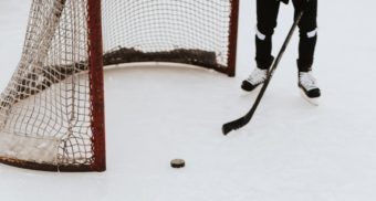 A photo of a person preparing to play some hockey. (Photo: Samantha Gades / Unsplash)