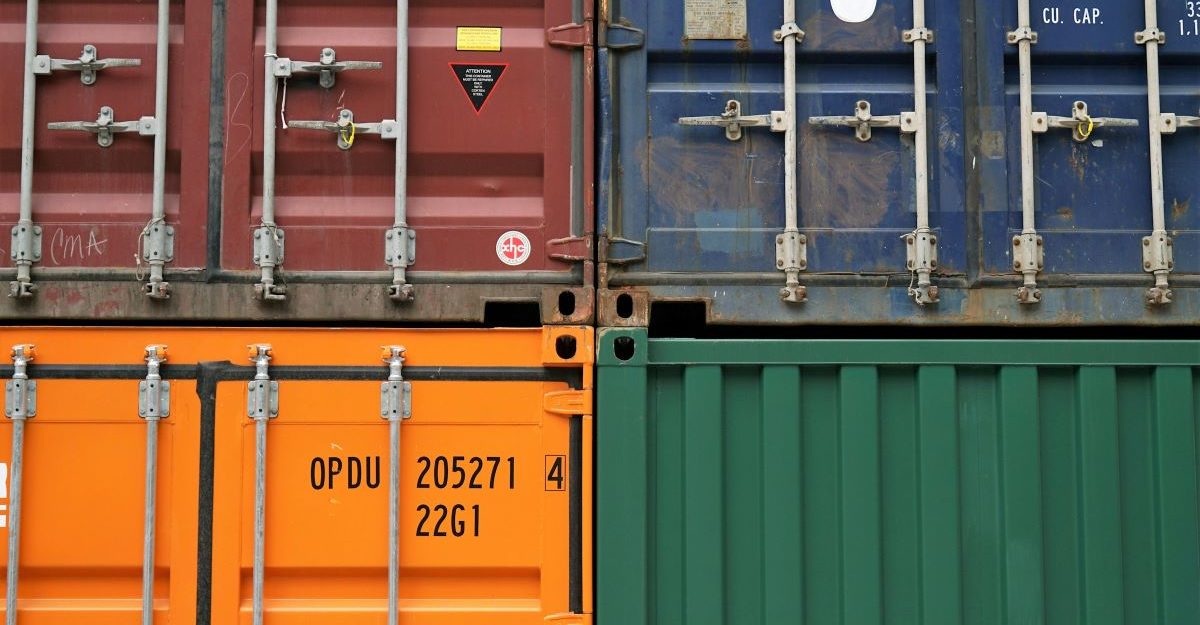 A number of steel containers stacked next to each other, potentially sold by WillScot of Canada.