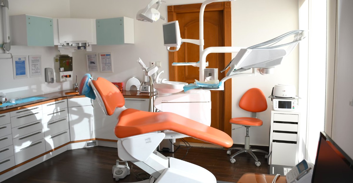 A dentist's office, featuring a dentist's chair and equipment, potentially used by Oak Dental Partnership.