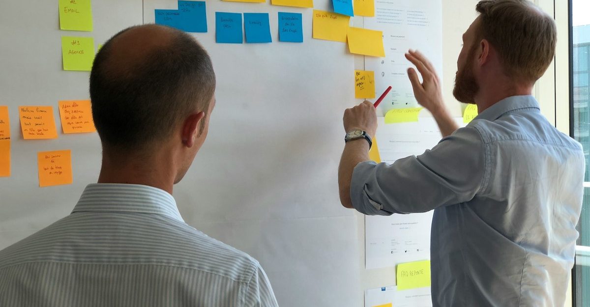 A supervisor reviews work performed by fellow team members.