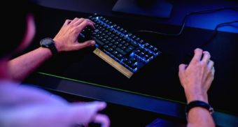 A photo of a person with headphones on using a mouse and keyboard, potentially working for Sumo Group. (Photo: ELLA DON / Unsplash)