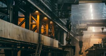 A labyrinth of walkways, ladders and equipment in a massive manufacturing plant. Cleveland-Cliffs employees are entitled to full severance pay when they lose their job.