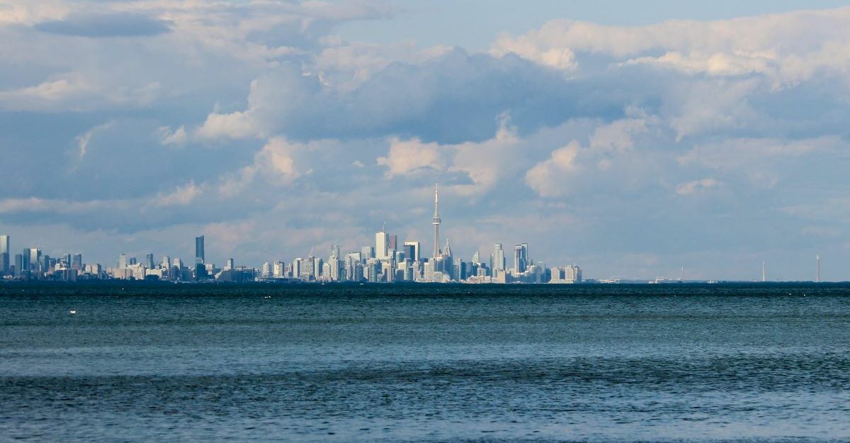 The Toronto skyline is seen in the distance next to Lake Ontario. Enwave uses the lake's water to naturally cool buildings.