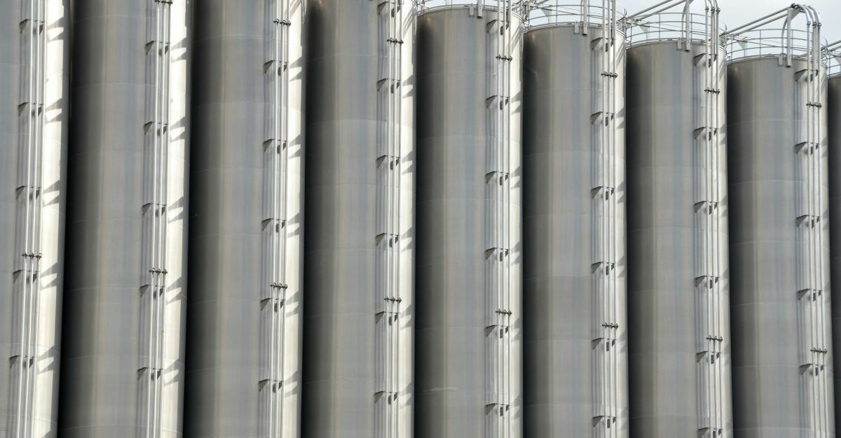 A number of tall, metal storage tanks, potentially used by Linde Canada.