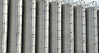 A number of tall, metal storage tanks, potentially used by Linde Canada.