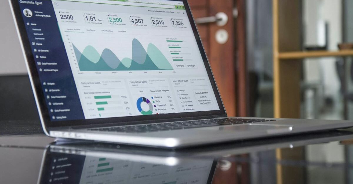 A laptop displays various points of data.