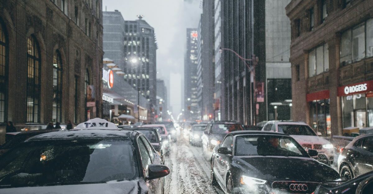 Traffic clogs a snow-covered street in downtown Toronto.