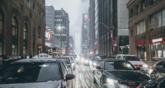 Traffic clogs a snow-covered street in downtown Toronto.