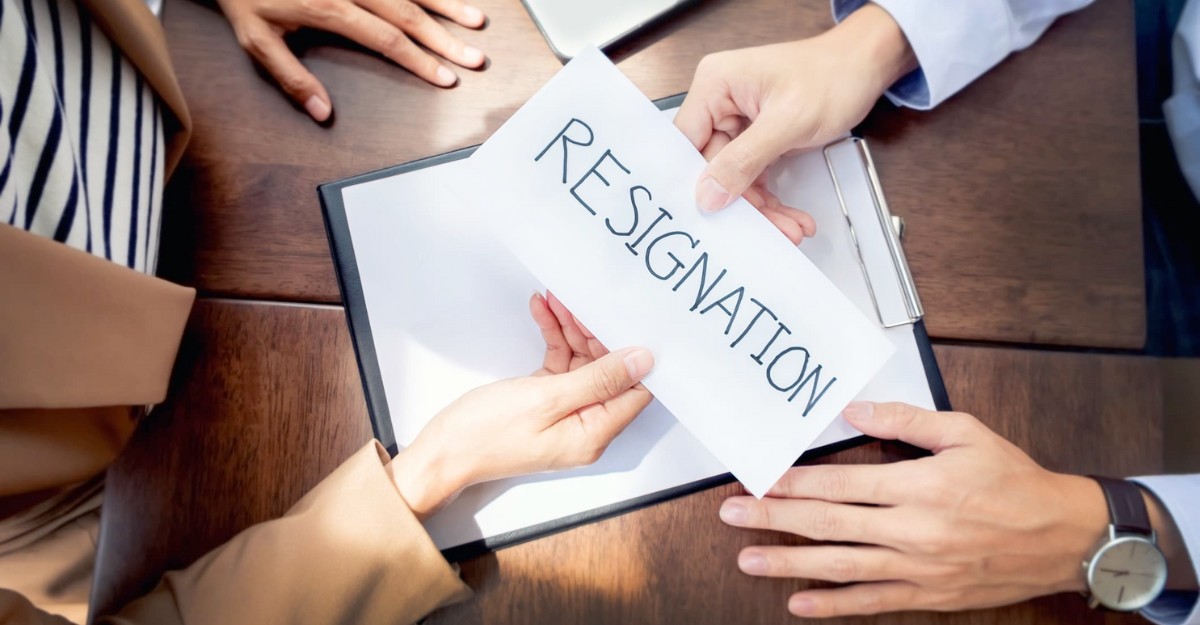 A person handing a resignation letter to their boss. (Photo: Audtakorn Sutarmjam, Getty Images)