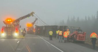 A photo of crews trying to bring a tractor-trailer back onto its wheels in Kingston. (Photo: OPP East Region / X)