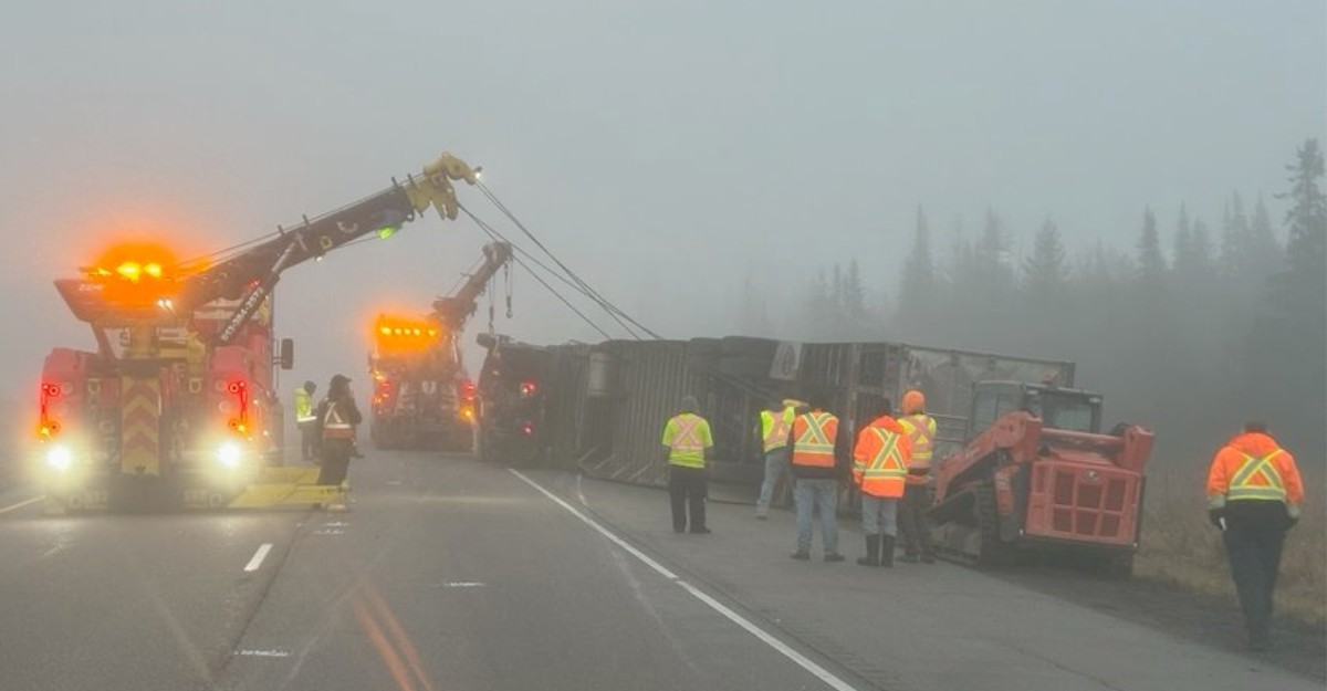 A photo of crews trying to bring a tractor-trailer back onto its wheels in Kingston. (Photo: OPP East Region / X)