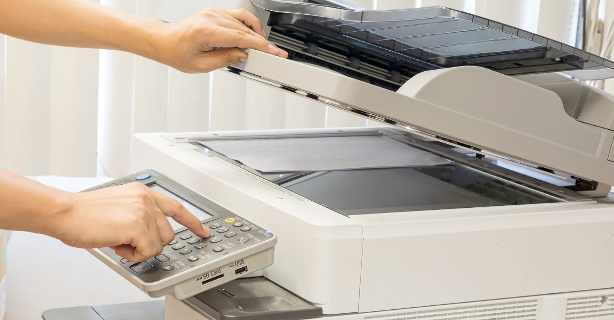 A photo of a person using a photocopier. (Photo: Google Images)