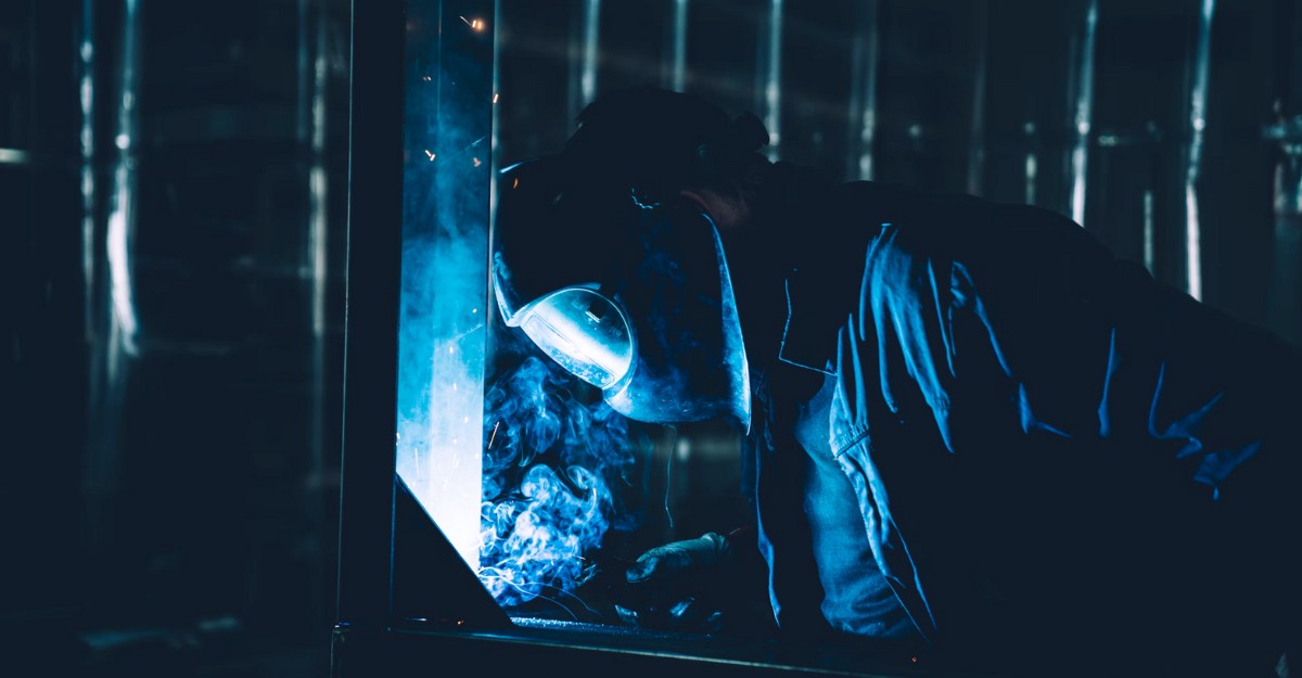 A photo of a welder working. (Photo: Dan Schiumarini / Unsplash)