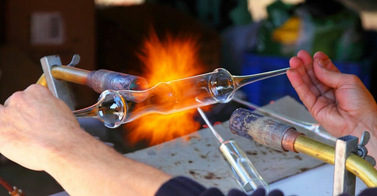 A skilled glassmaking professional at work.