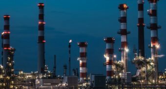 A photo of an energy facility at dusk. (Photo: qwitka / Unsplash)