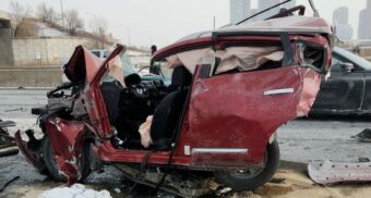 A photo of significant damage to a red vehicle on Highway 400 in Vaughan. (Photo: OPP / X/Twitter)