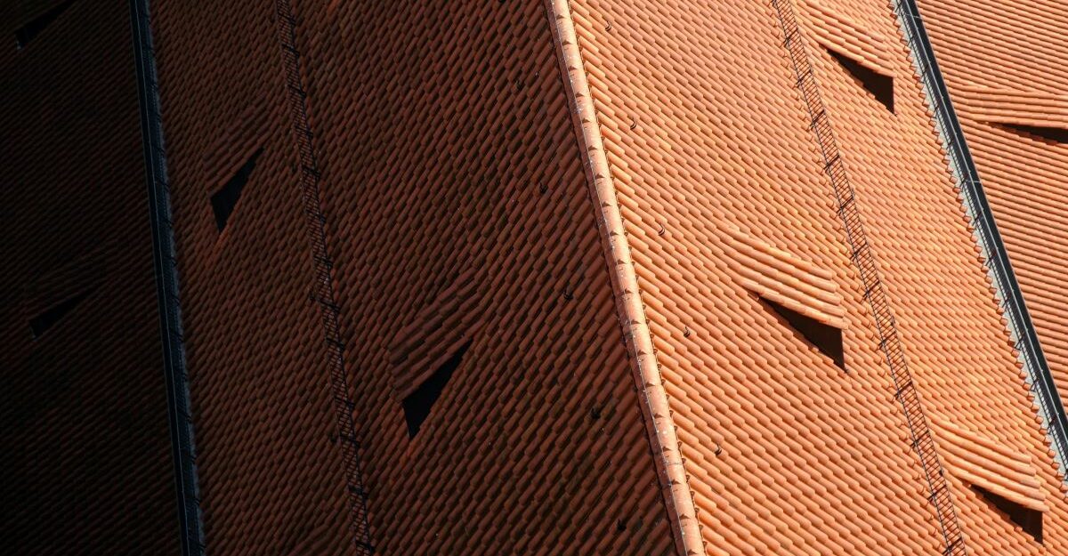 An aerial shot of a well-maintained Spanish tile roof.