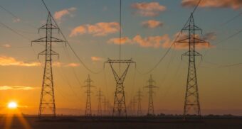 A photo of truss towers during a sunset. (Photo: Matthew Henry / Unsplash)