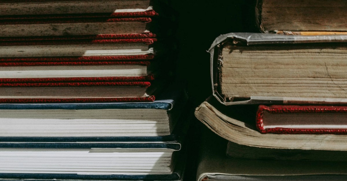 chegg-layoffs-severance A photo of textbooks stacked on top of each other. (Photo: hubiita / Unsplash)