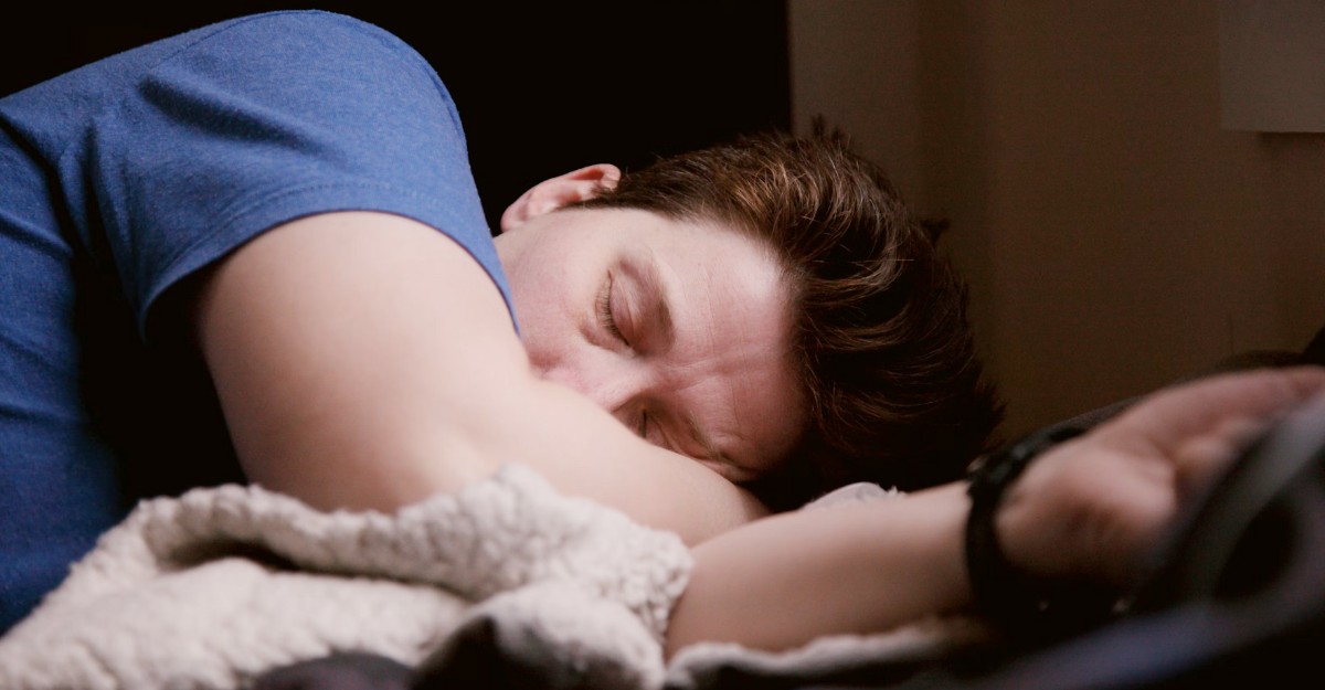 mouth-taping-sleep-apnea-study-2025 A photo of a person sleeping with their arm covering their mouth. (Photo: theyshane / Unsplash)