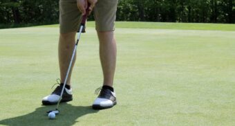 parkinsons-golf-course-study-may-2025 A photo of a person about to use a putter on a golf course. (Photo: tristin zeman / Unsplash)