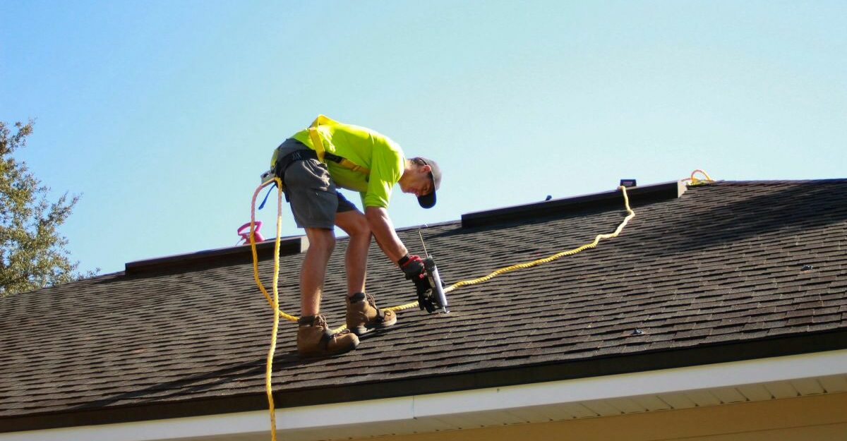 roofer-at-work A roofer is hard at work on a client's roof.