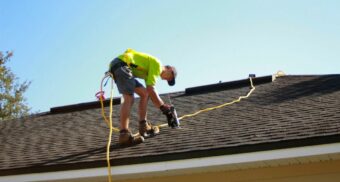 roofer-at-work A roofer is hard at work on a client's roof.
