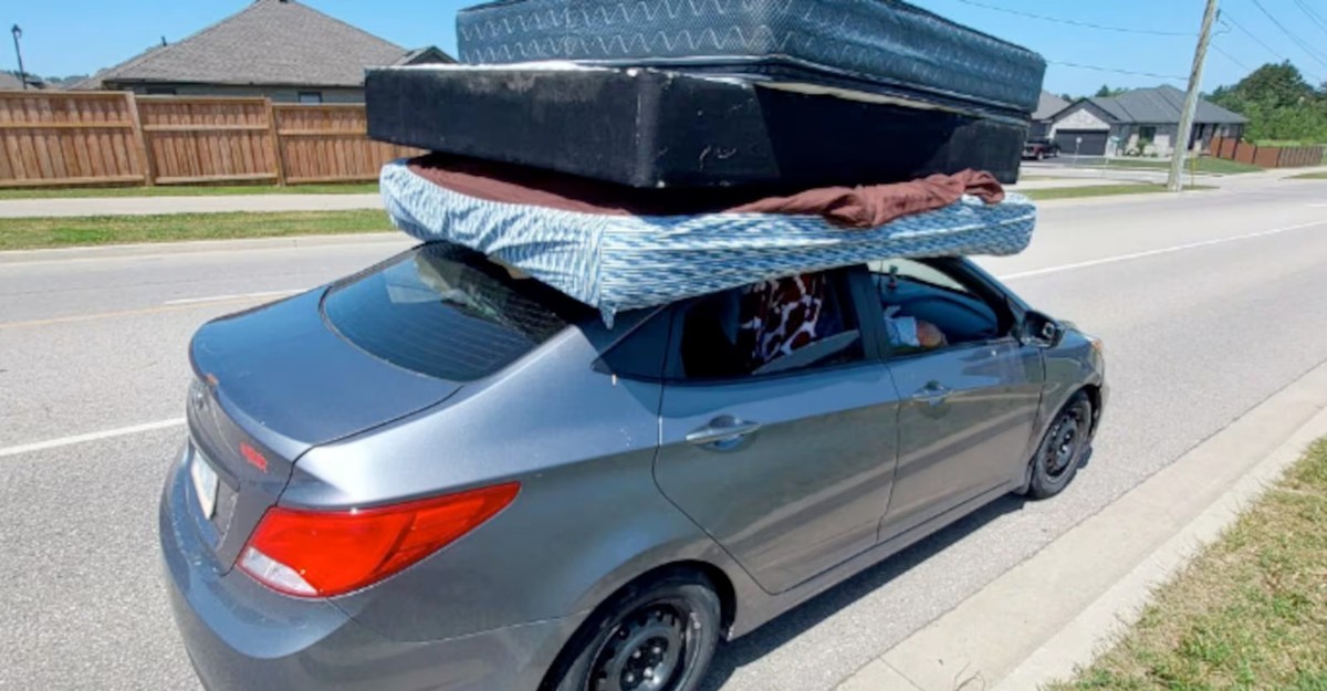 opp-driver-unsecured-mattresses-june-2025 A photo of a grey Hyundai Accent with unsecured mattresses on the roof stopped by police in Paris, Ontario. (Photo: OPP)