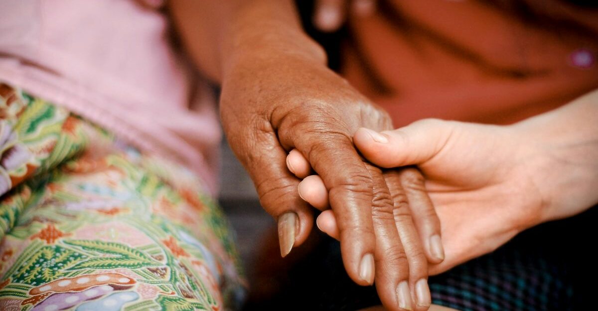 compassionate-leave-ontario A person is comforted by another individual in a time of need. (Unsplash)