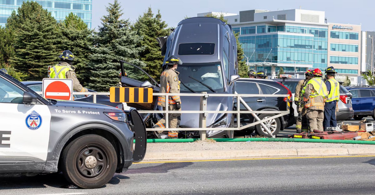 hwy-404-lexus-rollover-august-2025 A photo of a grey Lexus on top of another vehicle on Highway 404 near the Woodbine/Steeles off-ramp. (Photo supplied to CTV News Toronto)