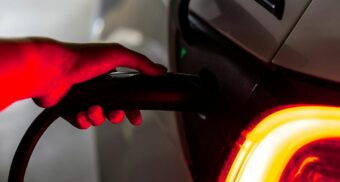 A clean energy electric vehicle (EV) is seen charging.
