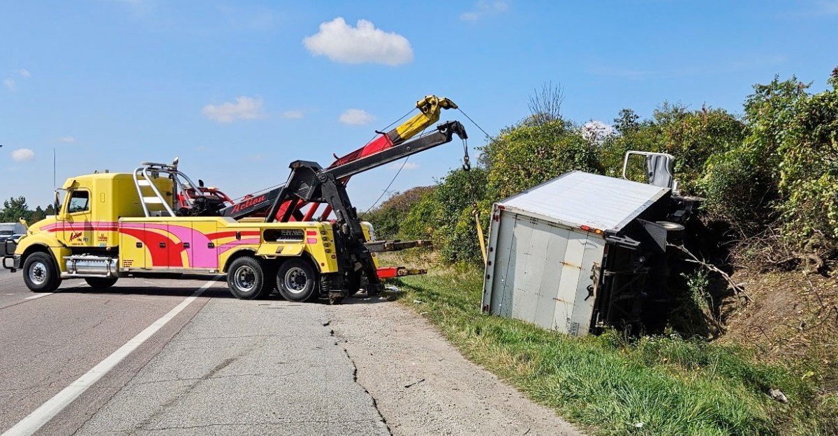 hwy-401-rollover-near-guelph-september-2025 A photo of a tow truck removing a commerical vehicle from a ditch on Highway 401, south of Guelph. (Photo: OPP_HSD / X/Twitter)