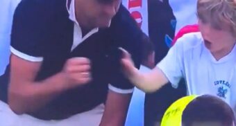 A screenshot of Piotr Szczerek, CEO of Drogbruk, taking Kamil Majchrzak's hat from a young fan at the 2025 US Open. (Photo: X)