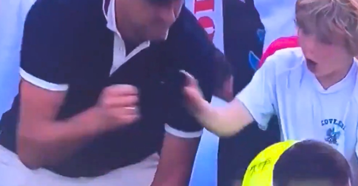us-open-hat-snatching-august-2025 A screenshot of Piotr Szczerek, CEO of Drogbruk, taking Kamil Majchrzak's hat from a young fan at the 2025 US Open. (Photo: X)