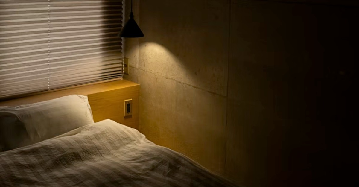 A bedroom at night with a light still on. (Photo: Susan Q Yin / Unsplash)