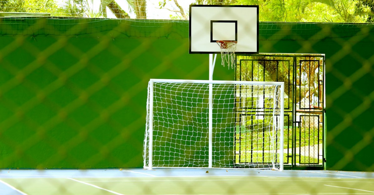 puma-layoffs-severance-pay A basketball net behind a soccer net. (Photo: Daniel Dan / Unsplash)