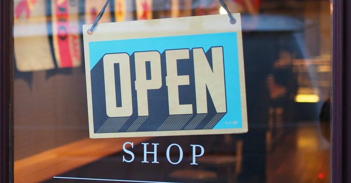 store-open-sign An open sign is seen in a store window.
