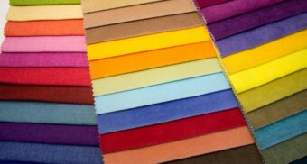 Dozens of swaths of colourful fabrics and materials.