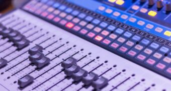 A grey and black audio mixer. (Photo: Anthony Roberts / Unsplash)