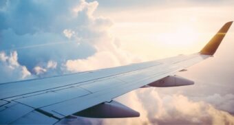 An aerial photo of an airplane wing. (Photo: Ross Parmly / Unsplash)