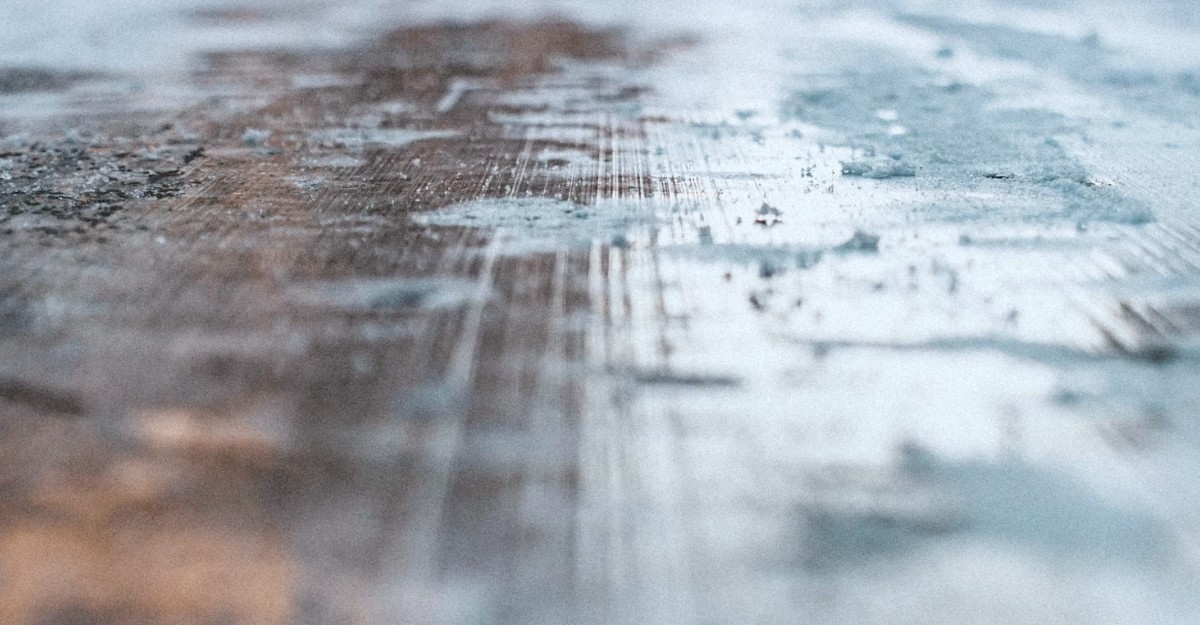 Black ice on a roadway. (Photo: Max Fuchs / Unsplash)