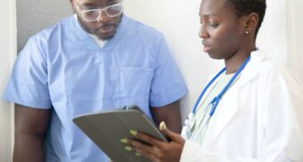 A nurse and doctor review medical information in a hospital. (Photo: Nappy Studio / Unsplash)