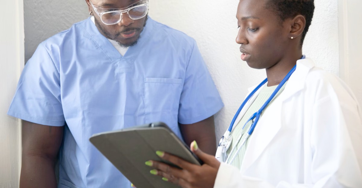 A nurse and doctor review medical information in a hospital. (Photo: Nappy Studio / Unsplash)