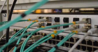 Ethernet cables plugged into ports. (Photo: Thomas Jensen / Unsplash)