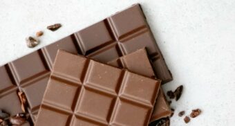 Two chocolate bars on a table. (Photo: Tetiana Bykovets / Unsplash)