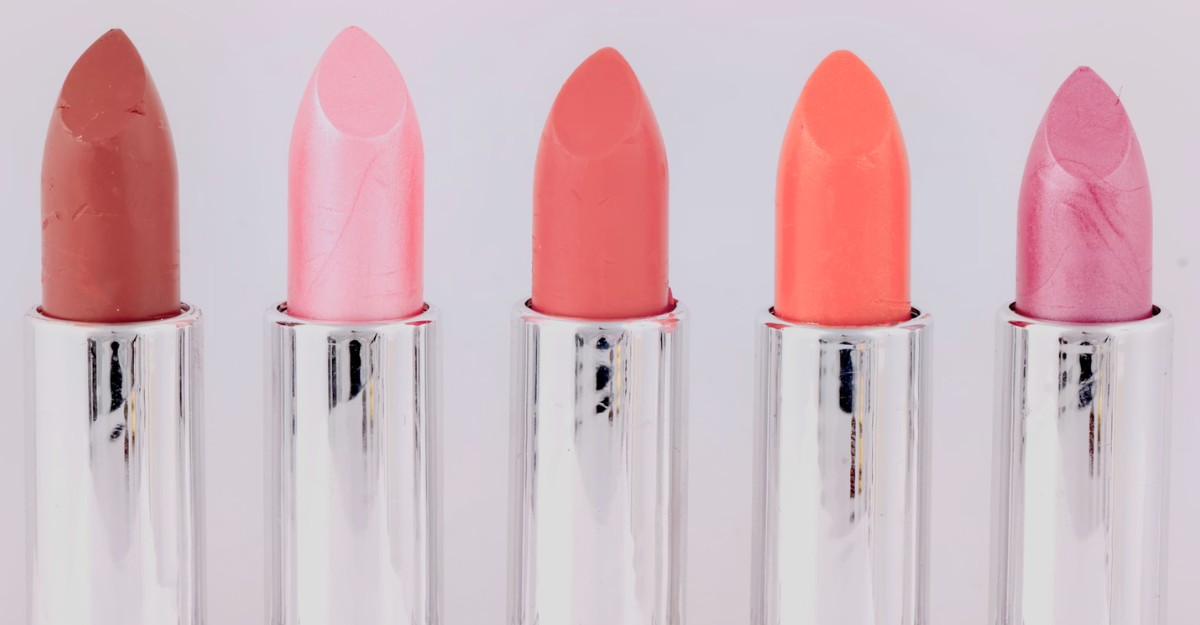 An assortment of lipstick on a table. (Photo: Marek Studzinski / Unsplash)